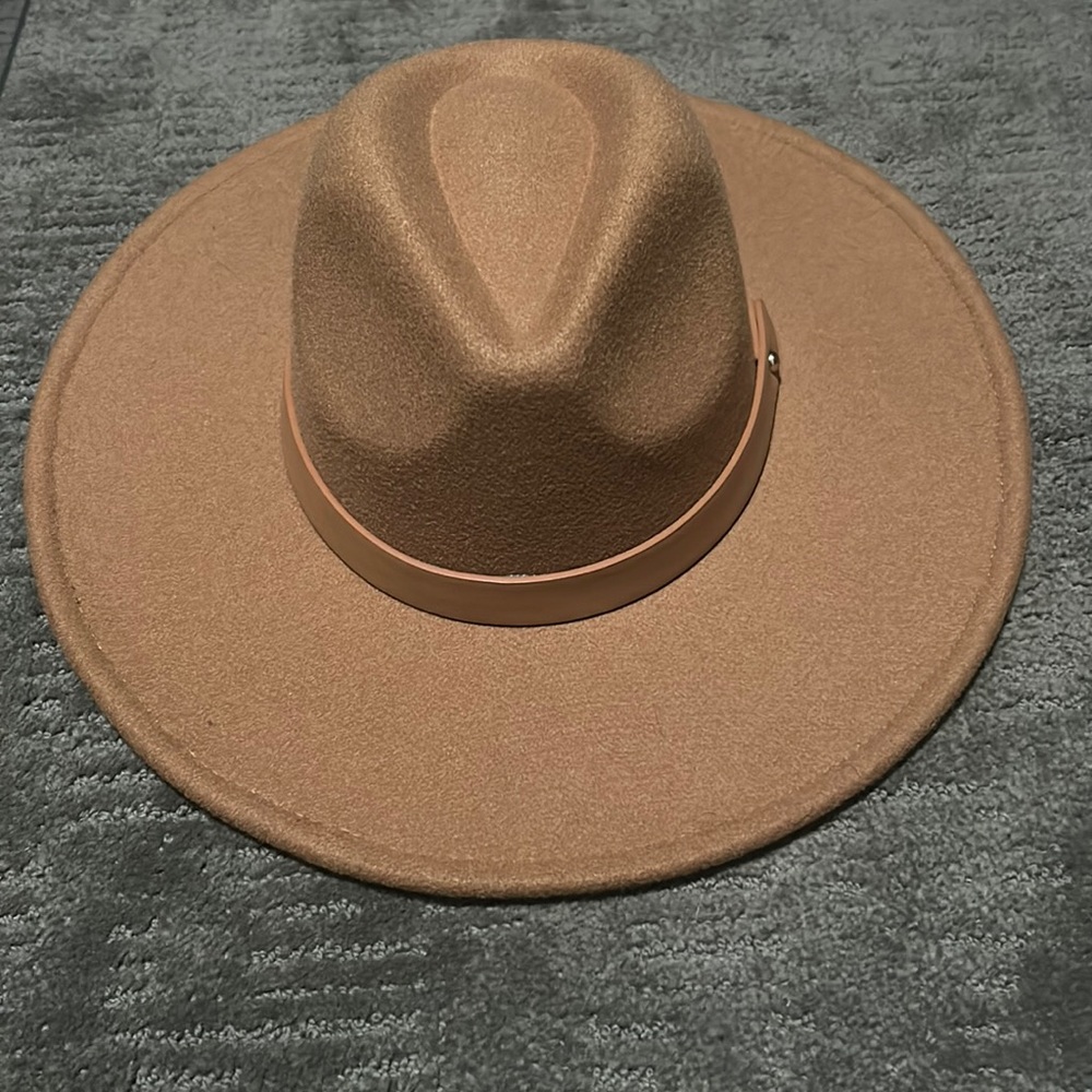 Women’s new without tags, large tan brimmed adjustable Vici hat.